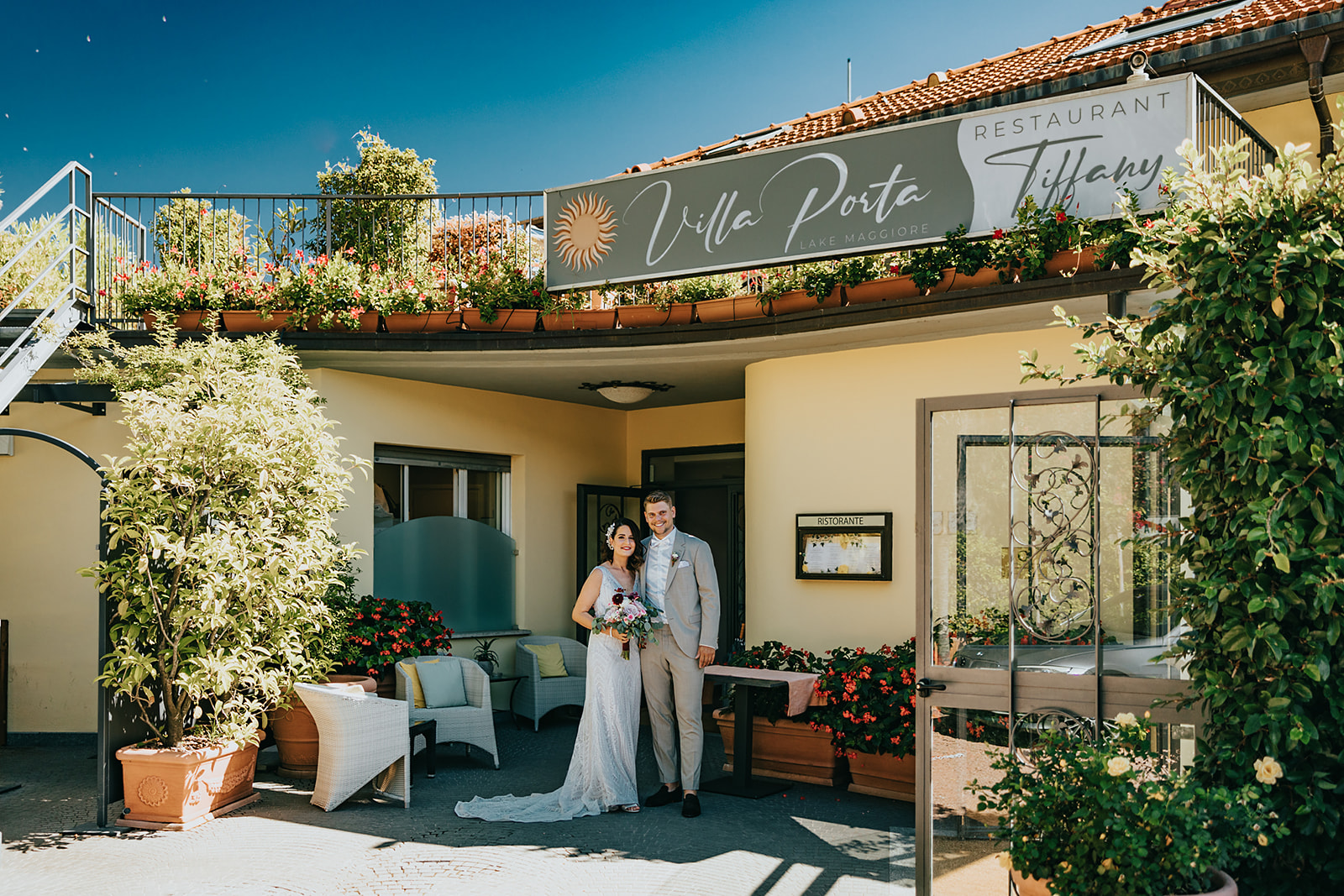 wedding couple at the front of villa porta Italy